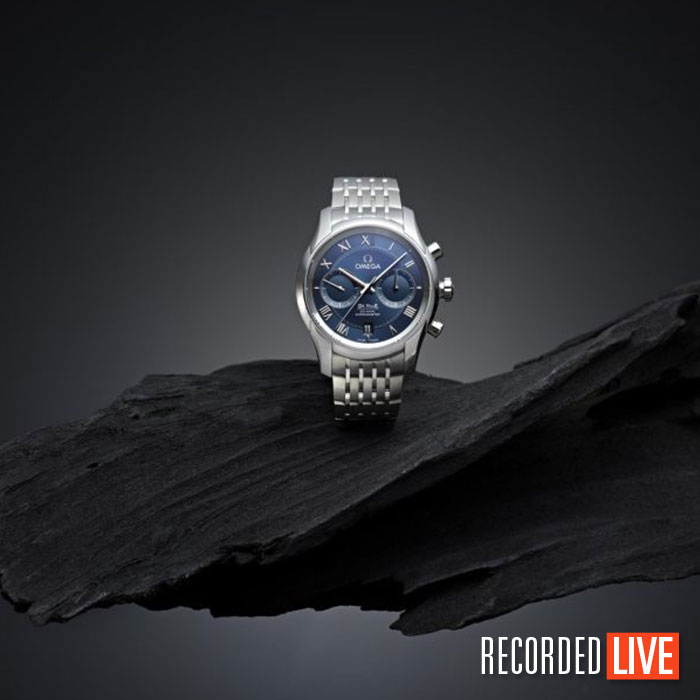 Luxury watch photographed on elegant wood