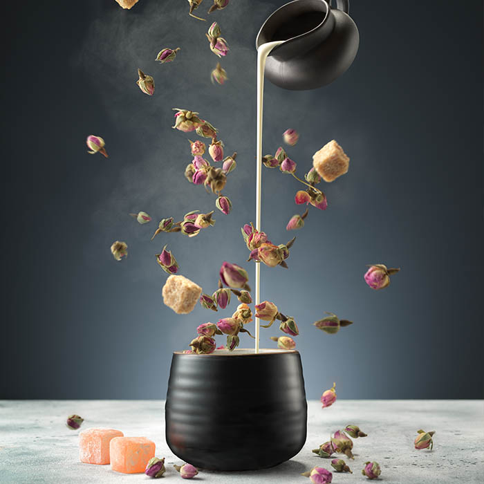 Photo of flying tea buds out of a teacup