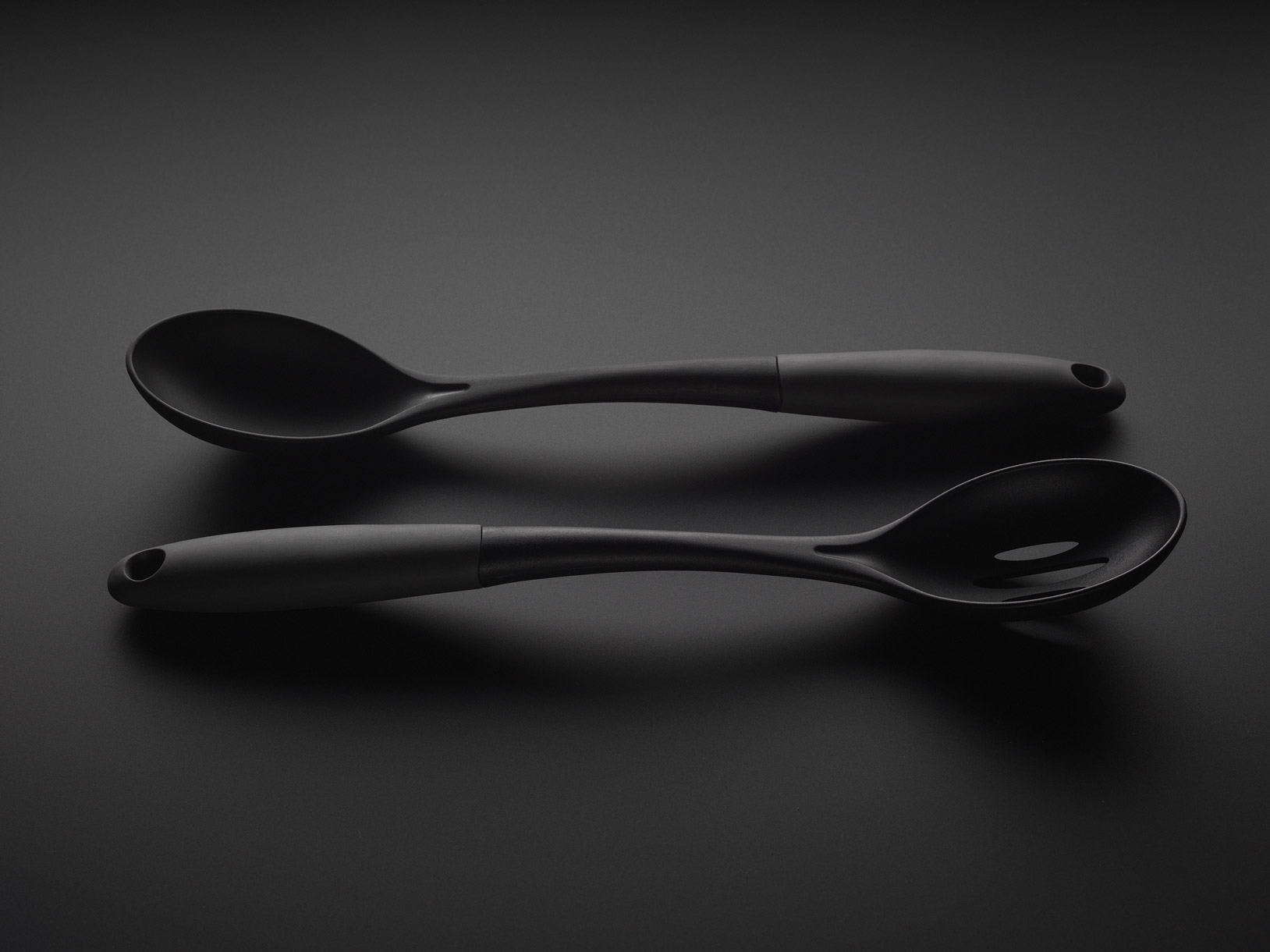 Kitchen utensils on a black background